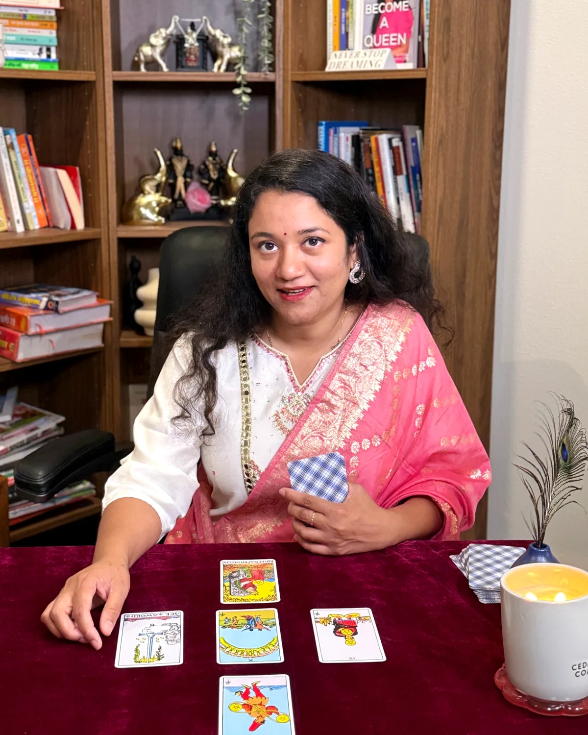 Nikita providing a personal tarot reading with tarot cards